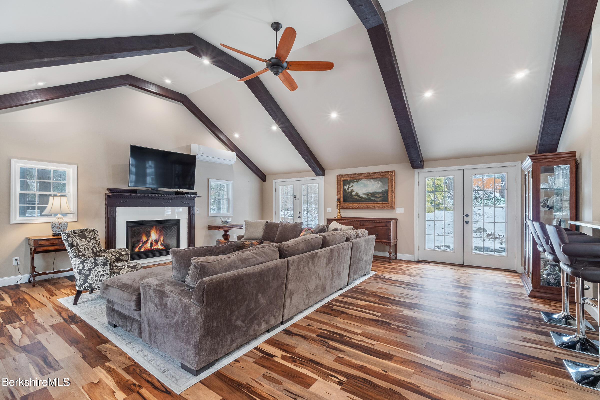 7 Hawthorne Road Stockbridge, MA 01262 - Photo 18 of 41 a living room with furniture a fireplace and a flat screen tv