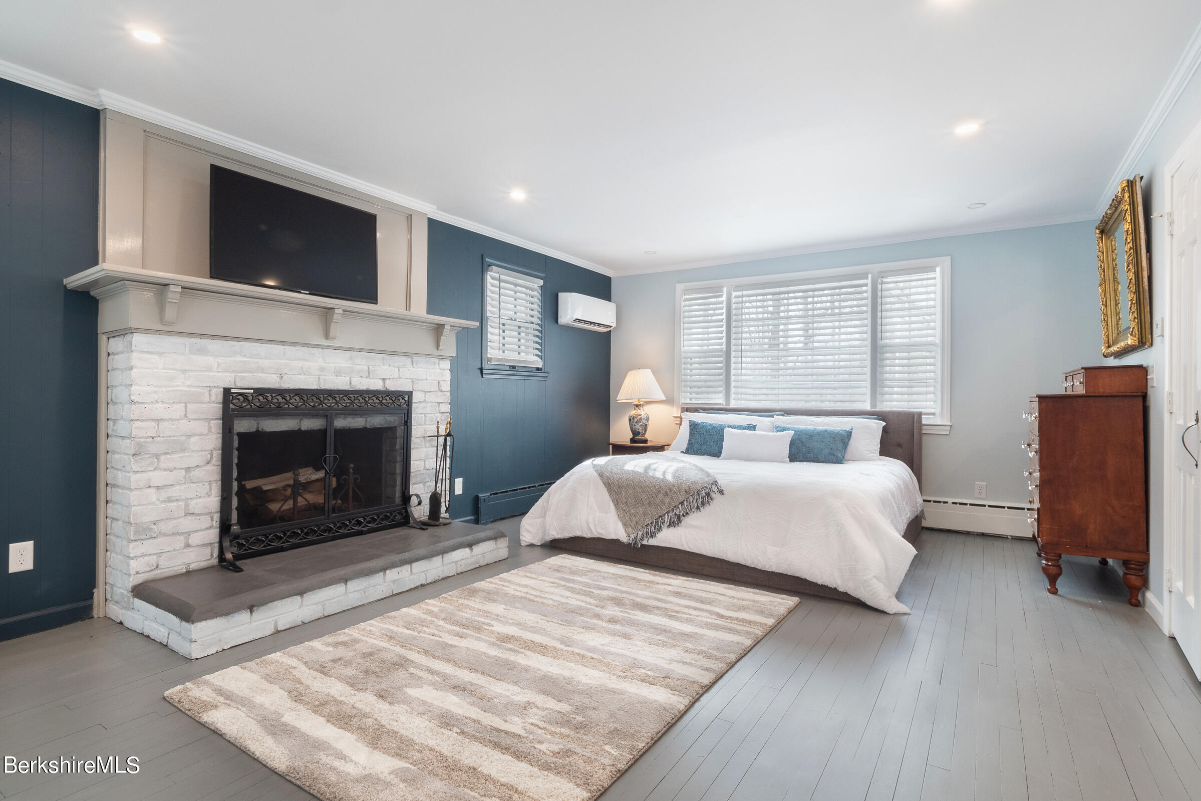 7 Hawthorne Road Stockbridge, MA 01262 - Photo 20 of 41 a bedroom with a bed and a fireplace