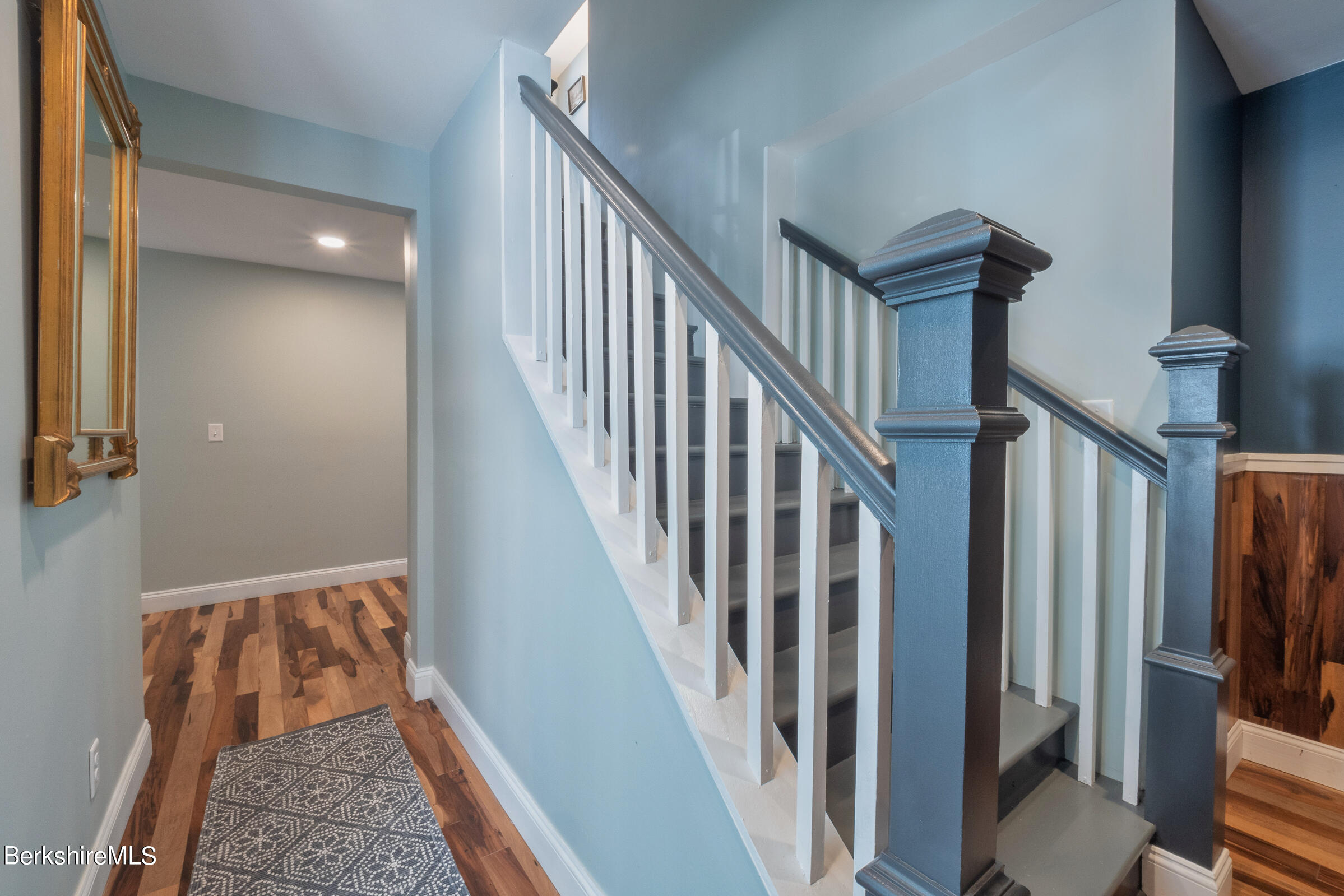 7 Hawthorne Road Stockbridge, MA 01262 - Photo 31 of 41 a view of a hallway with wooden floor and staircase