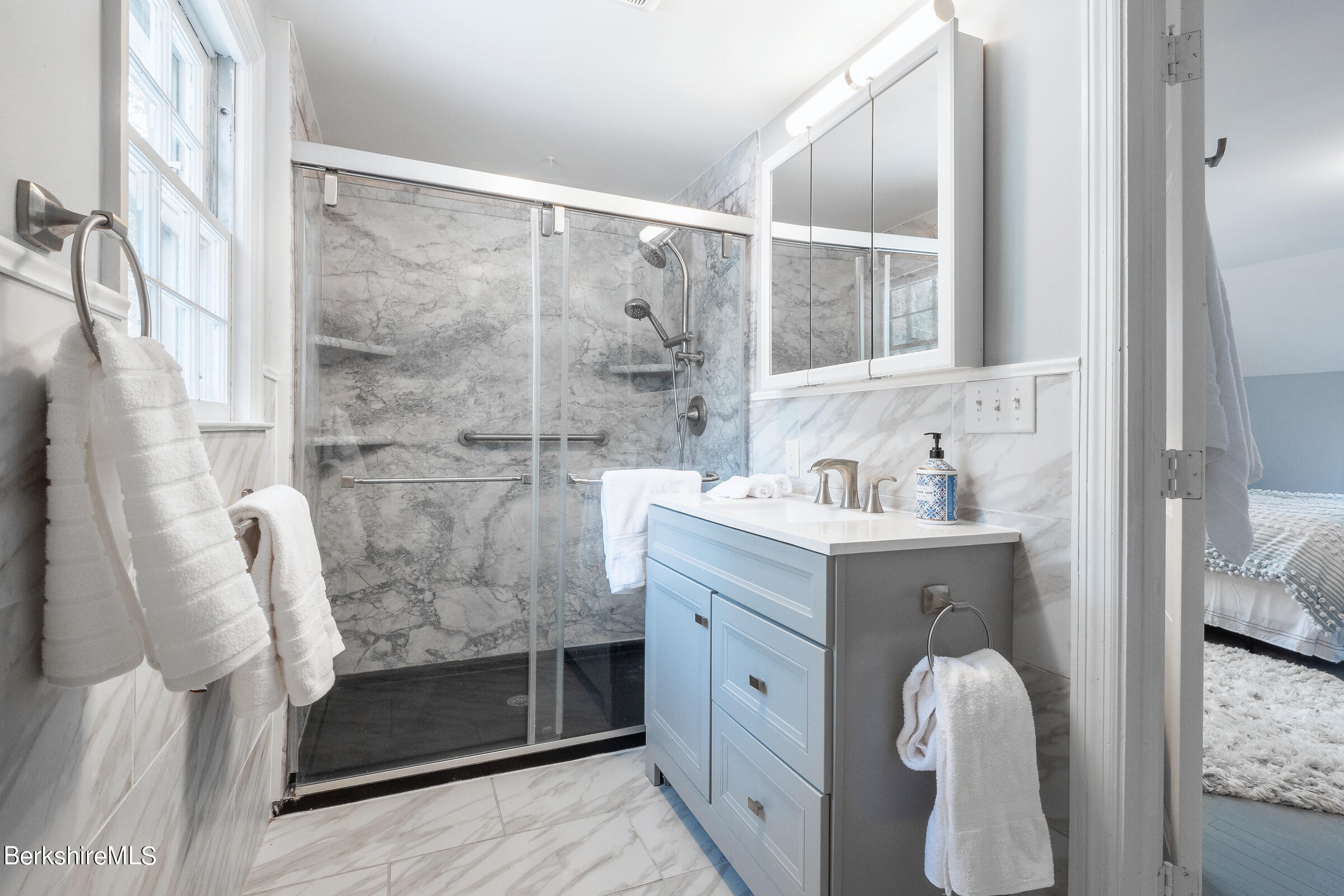 7 Hawthorne Road Stockbridge, MA 01262 - Photo 36 of 41 a bathroom with a shower sink and mirror