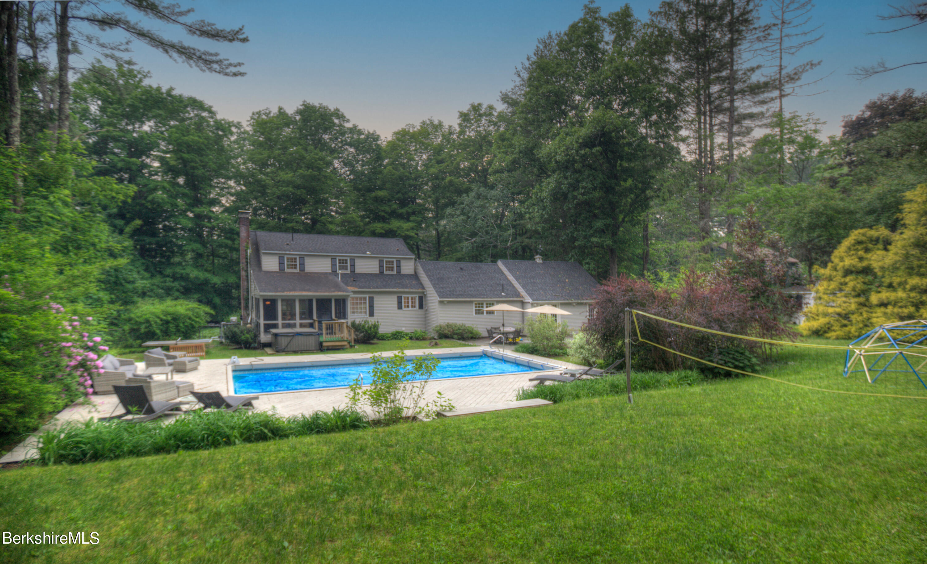 7 Hawthorne Road Stockbridge, MA 01262 - Photo 8 of 41 an aerial view of a house with a swimming pool