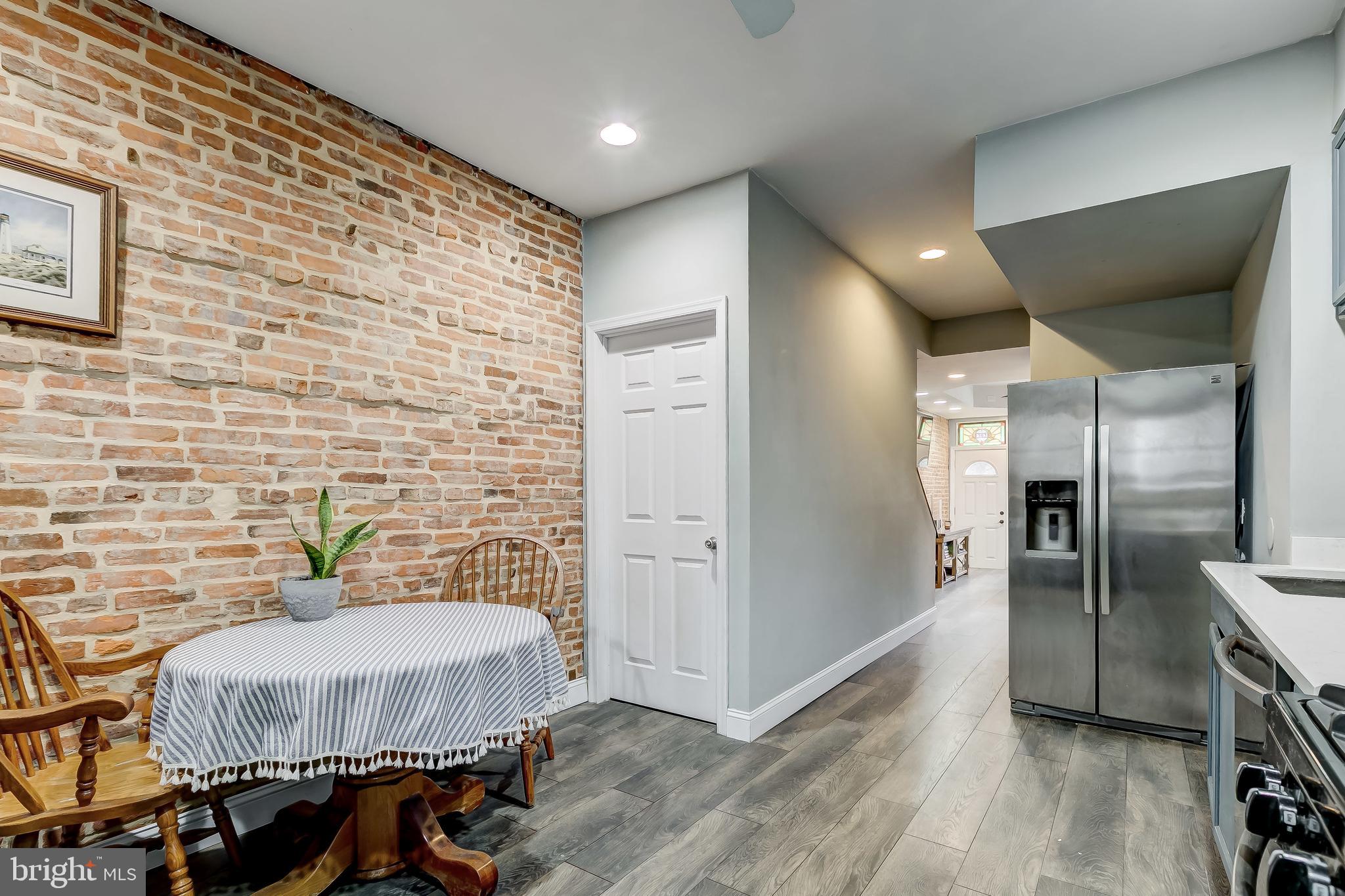 1404 Decatur Street Baltimore, MD 21230 - Photo 13 of 29 a bathroom with a sink and a refrigerator