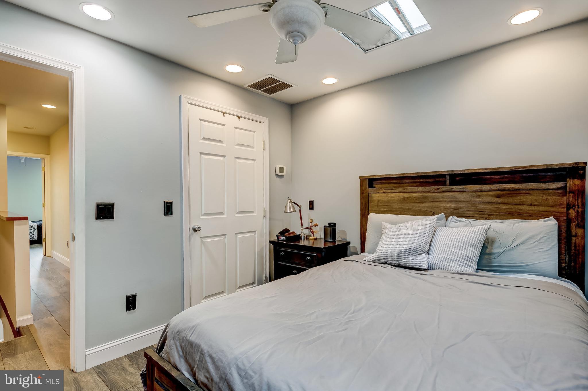 1404 Decatur Street Baltimore, MD 21230 - Photo 17 of 29 a bedroom with a bed and a refrigerator