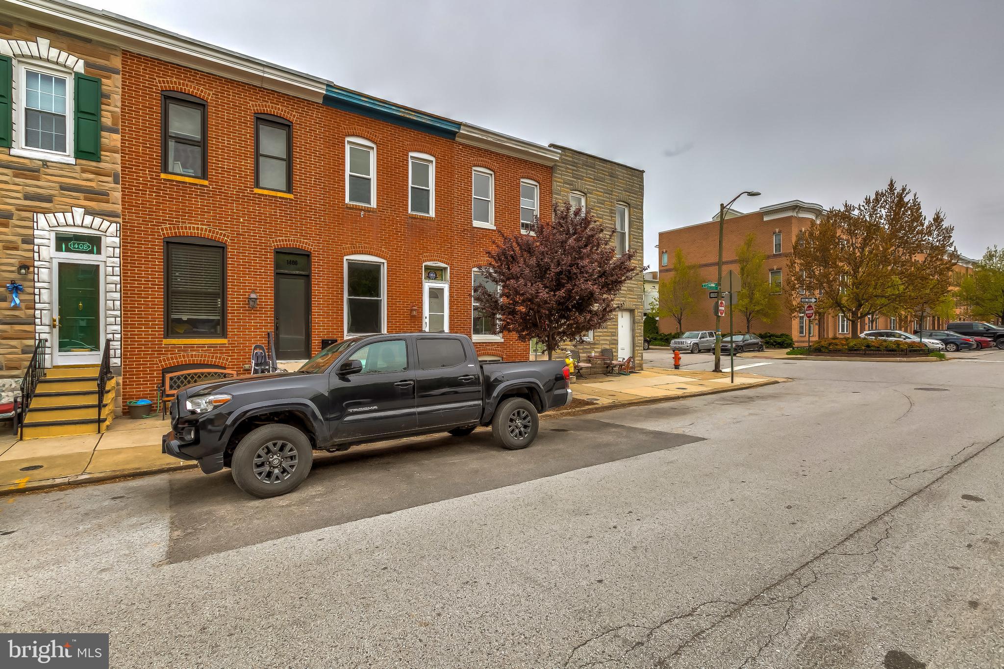 1404 Decatur Street Baltimore, MD 21230 - Photo 3 of 29 a car parked in front of a building