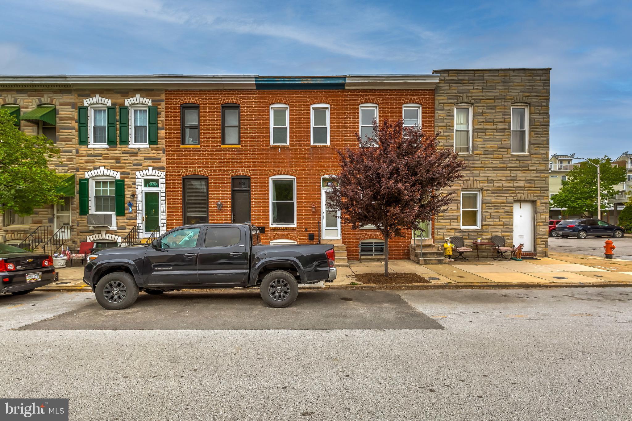 1404 Decatur Street Baltimore, MD 21230 - Photo 29 of 29 a front view of a house with a parking space