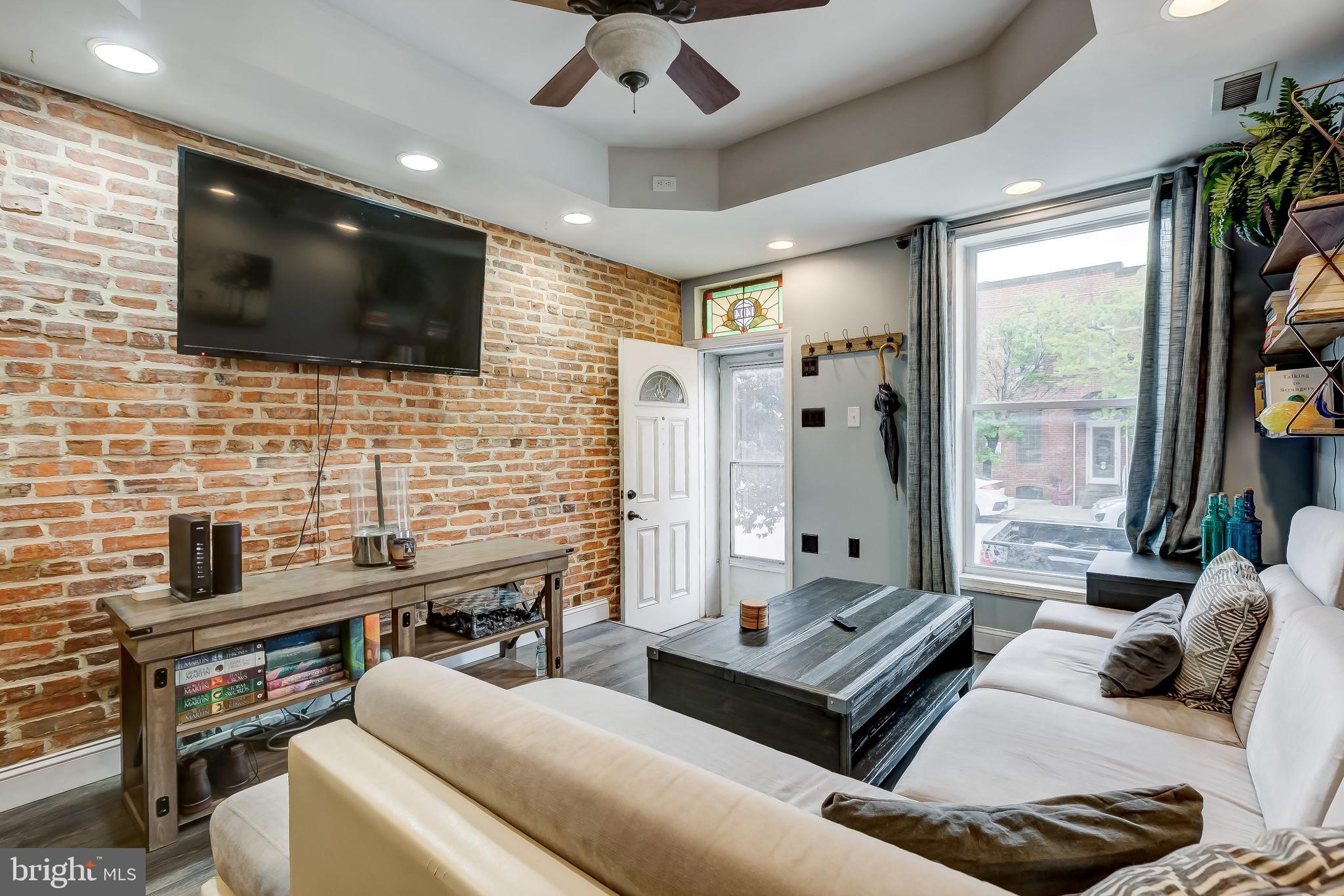 1404 Decatur Street Baltimore, MD 21230 - Photo 5 of 29 a living room with furniture and a flat screen tv