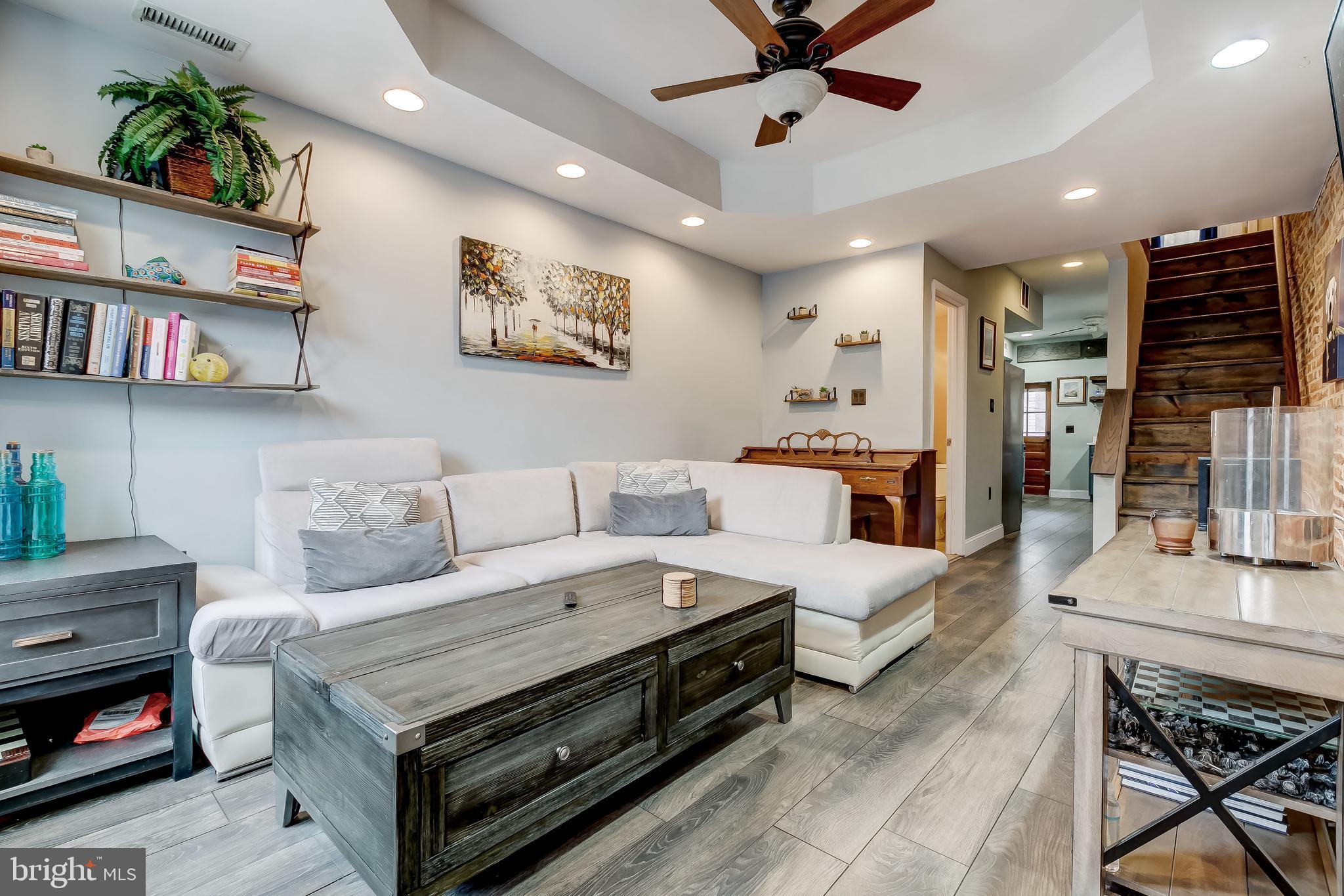 1404 Decatur Street Baltimore, MD 21230 - Photo 6 of 29 a living room with furniture and a book shelf