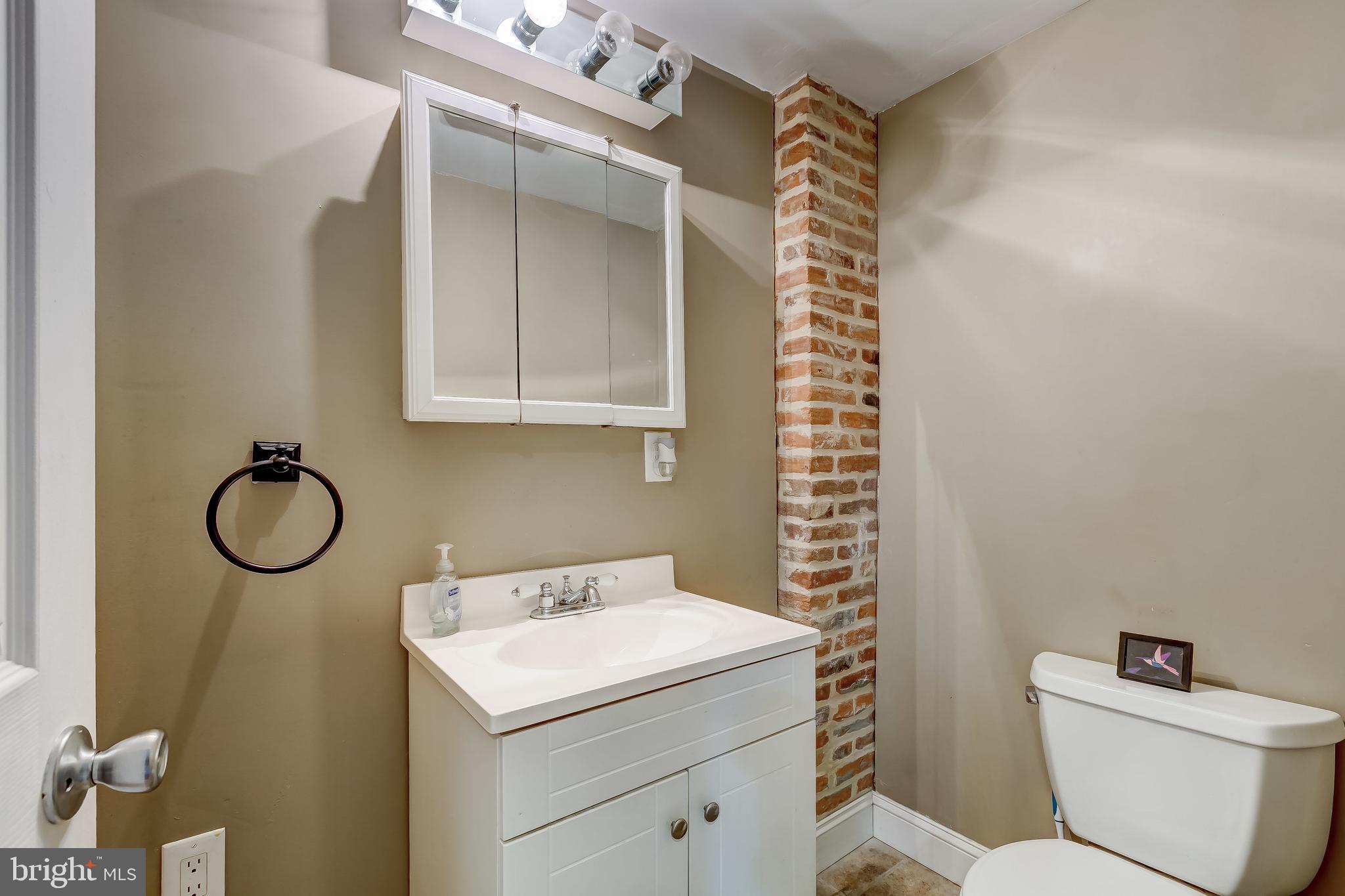 1404 Decatur Street Baltimore, MD 21230 - Photo 7 of 29 a bathroom with a sink toilet and shower