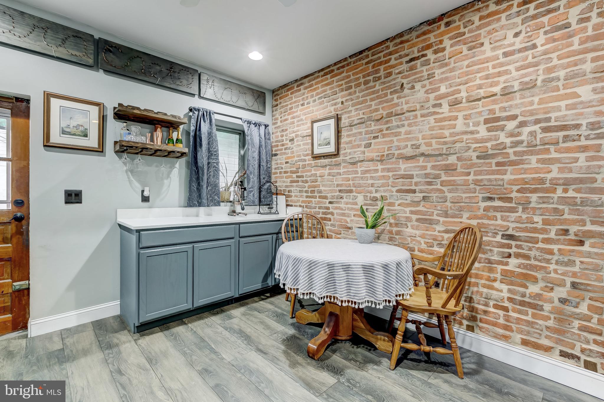 1404 Decatur Street Baltimore, MD 21230 - Photo 10 of 29 a living room with patio furniture and a wooden floor