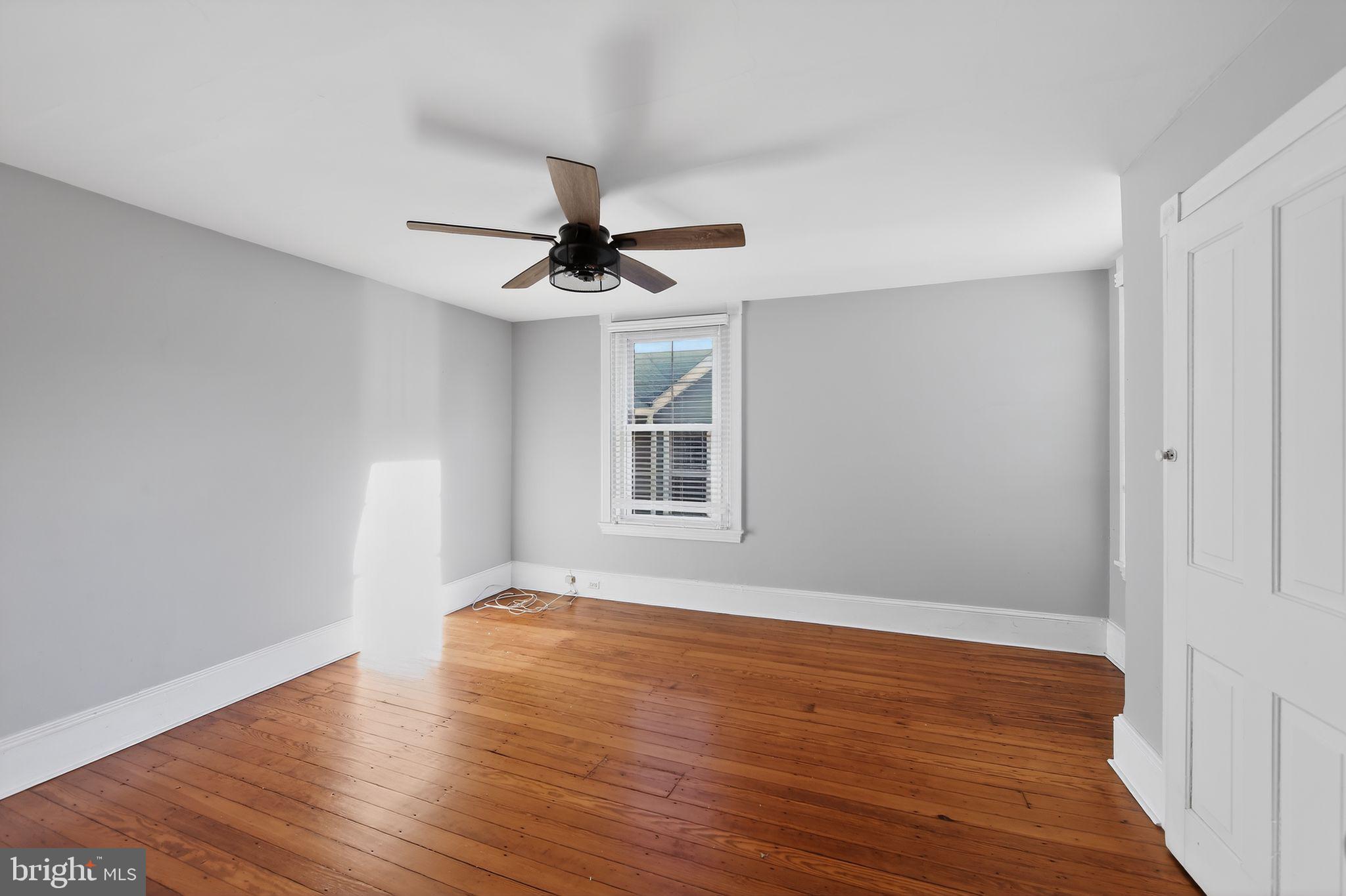 26 Waterloo Avenue Berwyn, PA 19312 - Photo 19 of 31 a view of an empty room with wooden floor and a window