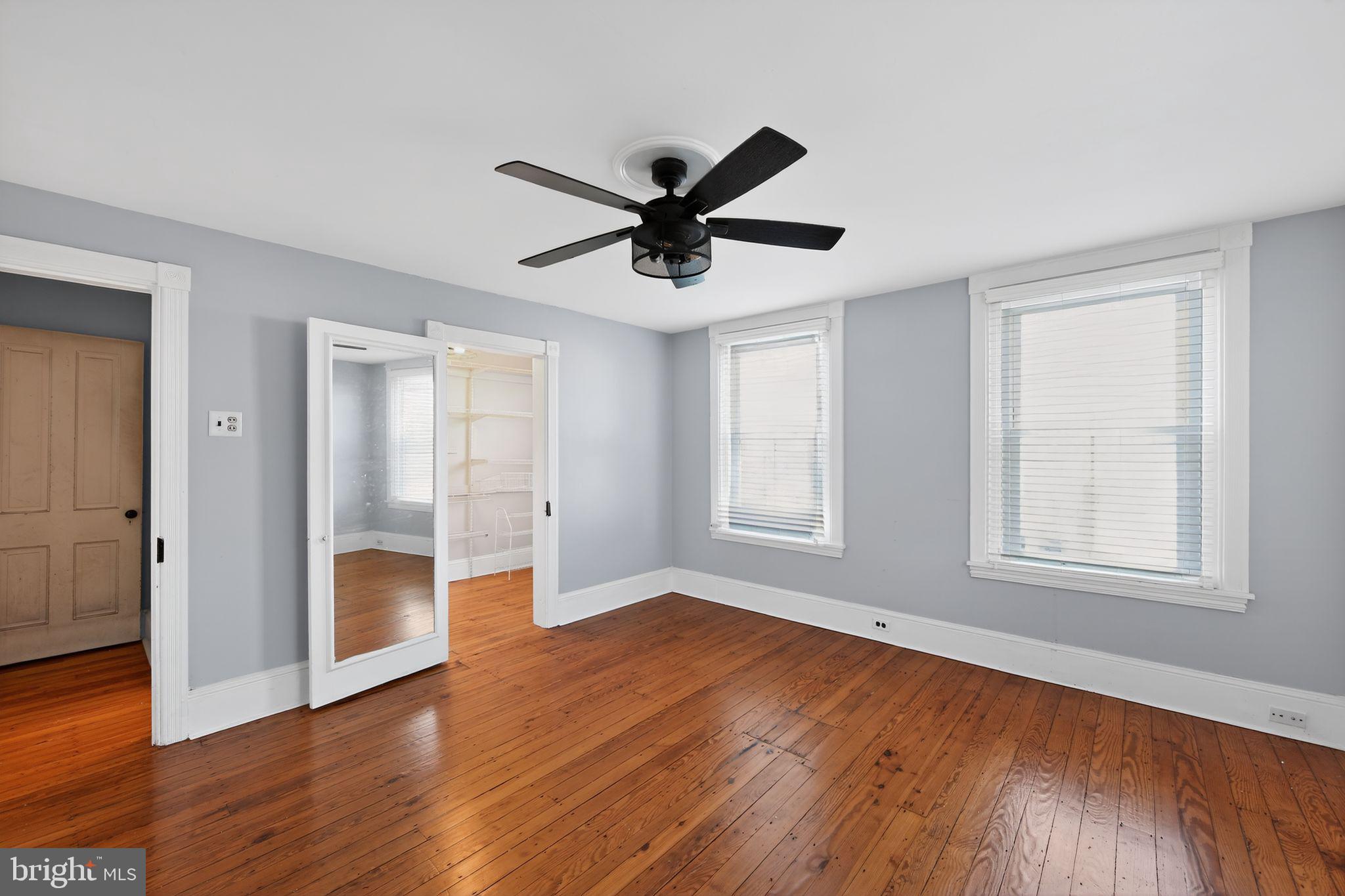 26 Waterloo Avenue Berwyn, PA 19312 - Photo 24 of 31 a view of empty room with wooden floor and ceiling fan