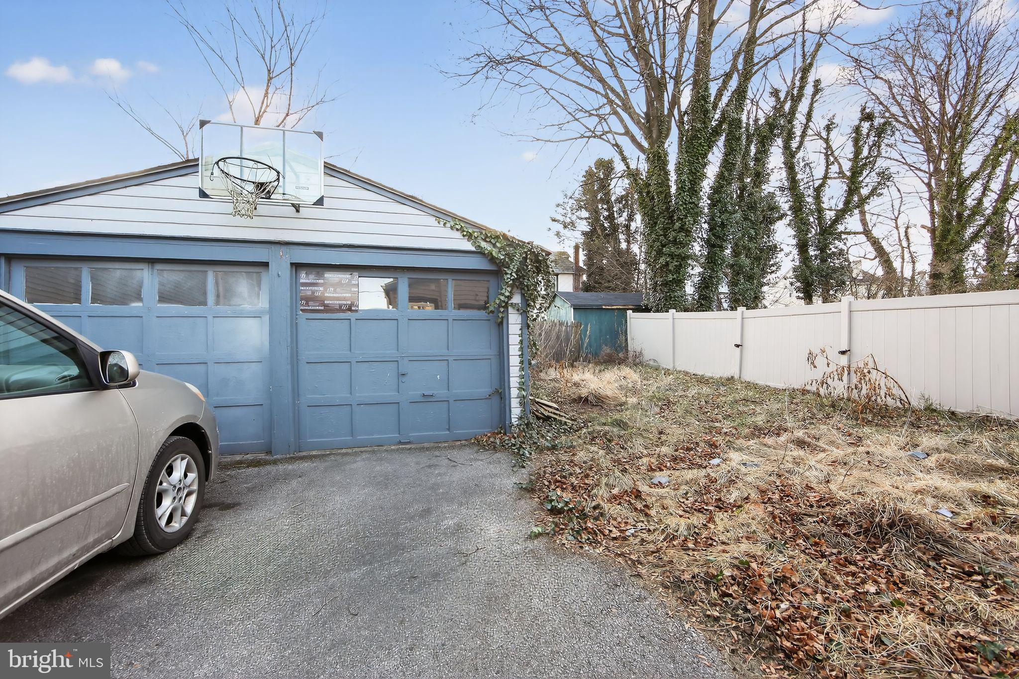 26 Waterloo Avenue Berwyn, PA 19312 - Photo 5 of 31 a view of a garage and a car parked in a yard
