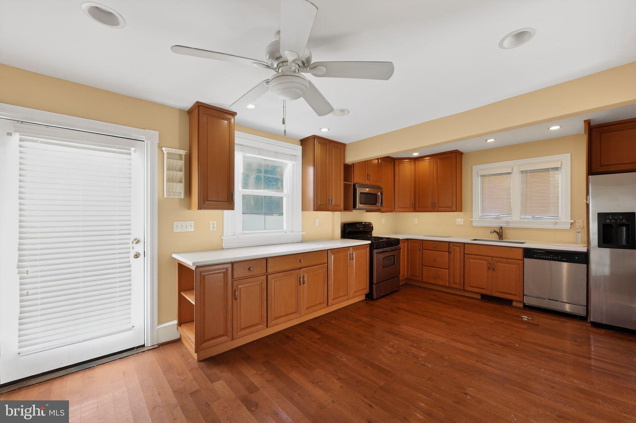 26 Waterloo Avenue Berwyn, PA 19312 - Photo 9 of 31 a large kitchen with stainless steel appliances granite countertop a lot of counter space and wooden floors