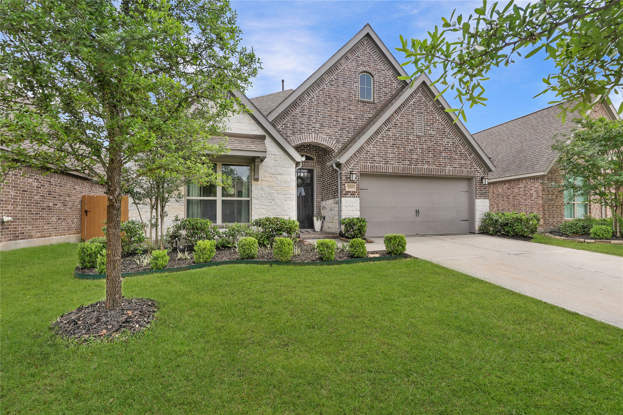 28169 Knight Peak Drive Spring, TX 77386 - Photo 31 of 33 a front view of a house with garden