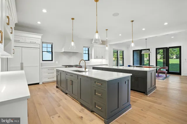 a bedroom with a large bed and a large window