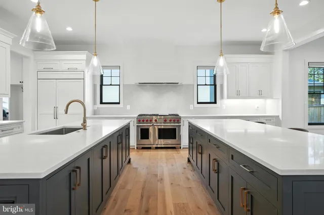 a view of a hallway with wooden floor and windows