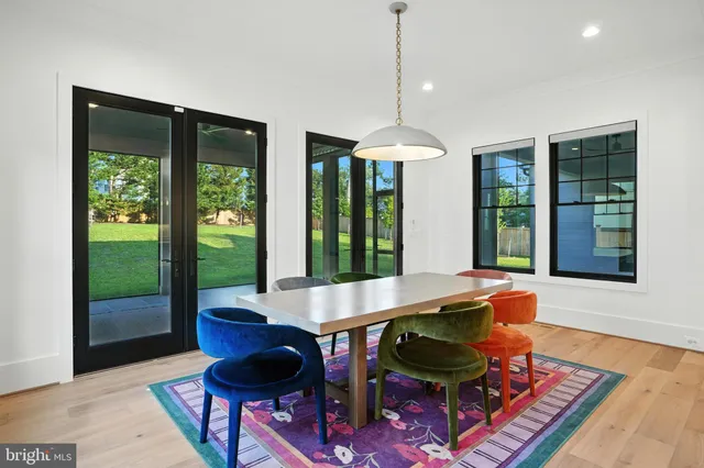 a view of a bedroom with furniture and windows