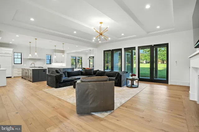a living room with furniture fireplace and flat screen tv