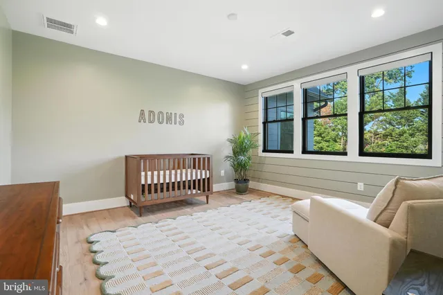 a view of staircase with white walls and white door