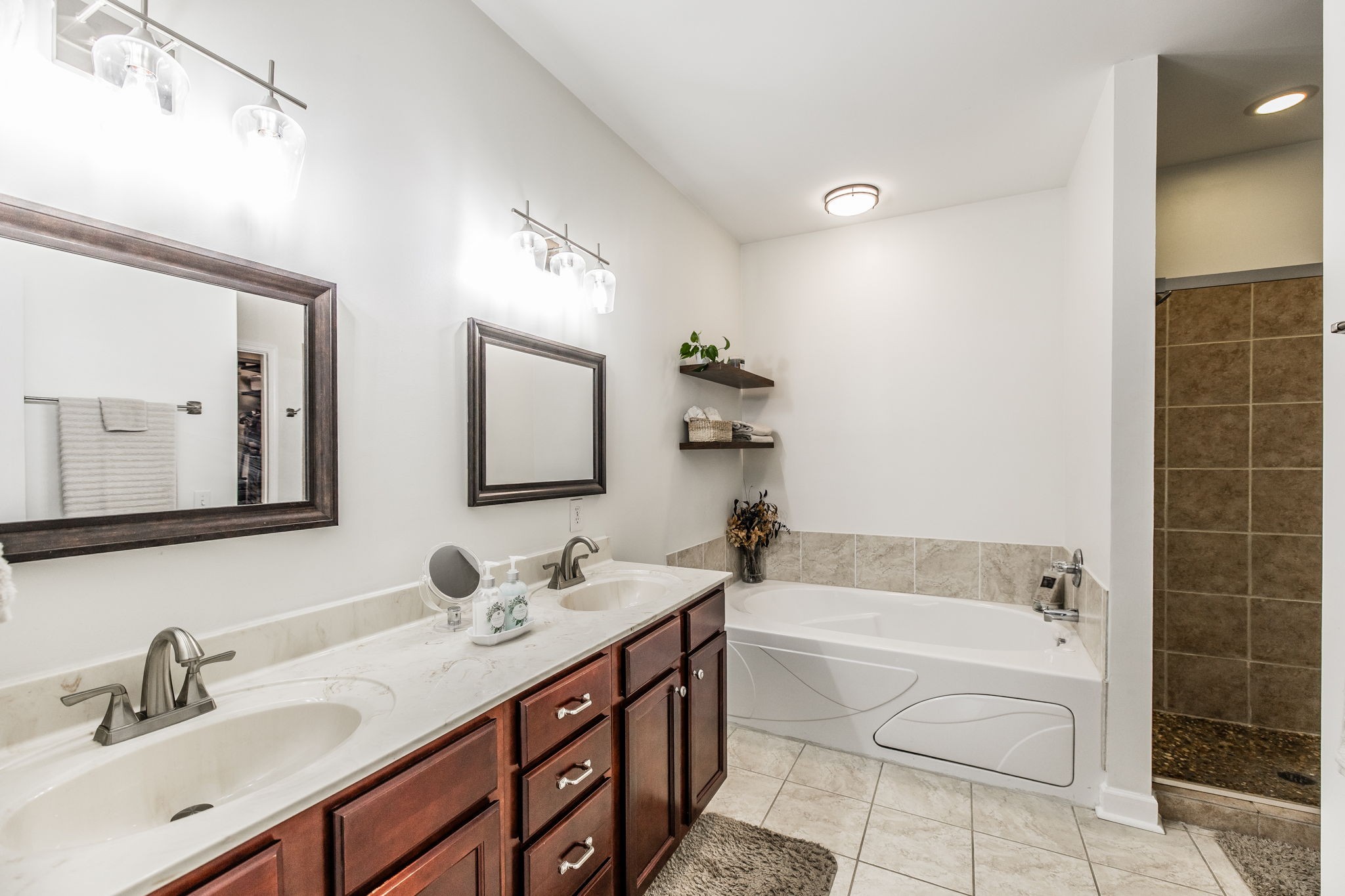 2860 Morgan Road Joelton, TN 37080 - Photo 20 of 45 a bathroom with a tub a sink and mirror