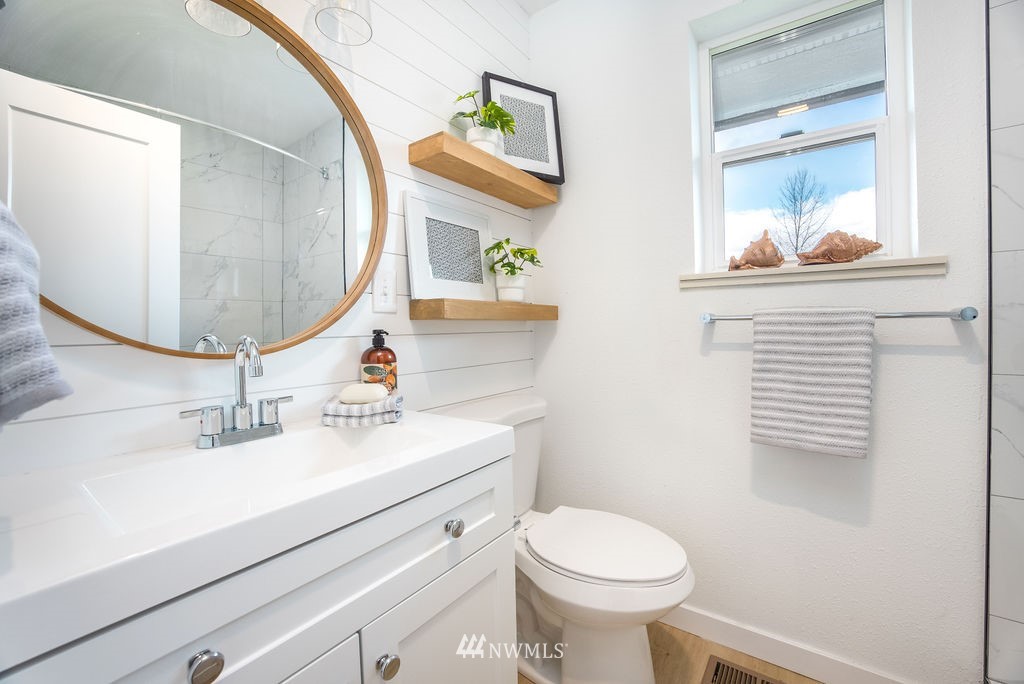 12425 Highway 12 Rochester, WA 98579 - Photo 13 of 29 a bathroom with a sink a toilet and a mirror