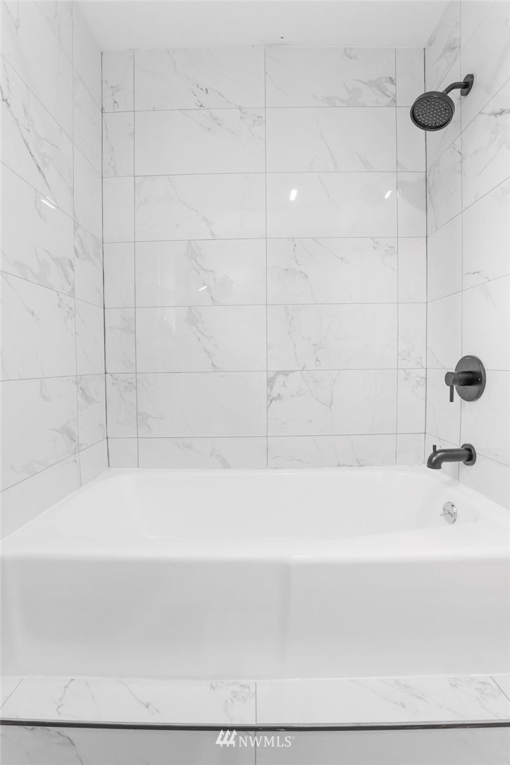 12425 Highway 12 Rochester, WA 98579 - Photo 14 of 29 a bathroom with a bathtub and a shower
