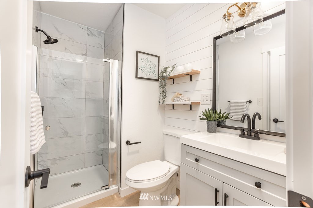 12425 Highway 12 Rochester, WA 98579 - Photo 18 of 29 a bathroom with a sink toilet and shower