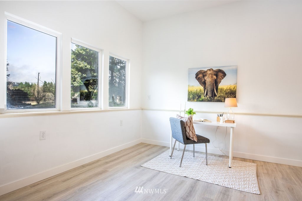 12425 Highway 12 Rochester, WA 98579 - Photo 22 of 29 a workspace with wooden floor and a window