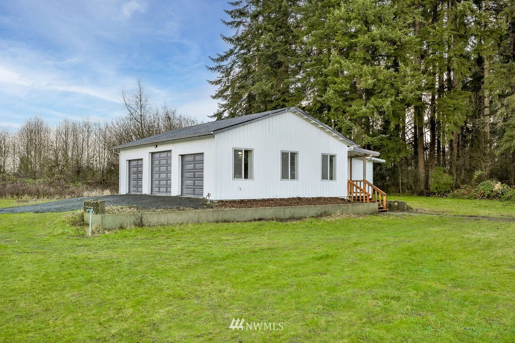 12425 Highway 12 Rochester, WA 98579 - Photo 25 of 29 a view of a house with a yard and sitting area
