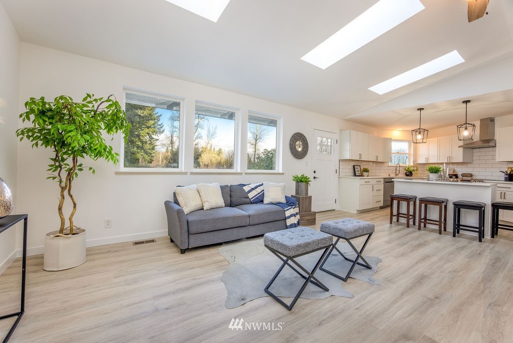 12425 Highway 12 Rochester, WA 98579 - Photo 7 of 29 a living room with furniture and a table