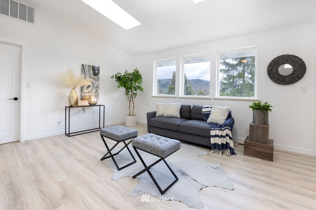 12425 Highway 12 Rochester, WA 98579 - Photo 8 of 29 a living room with furniture and a large window