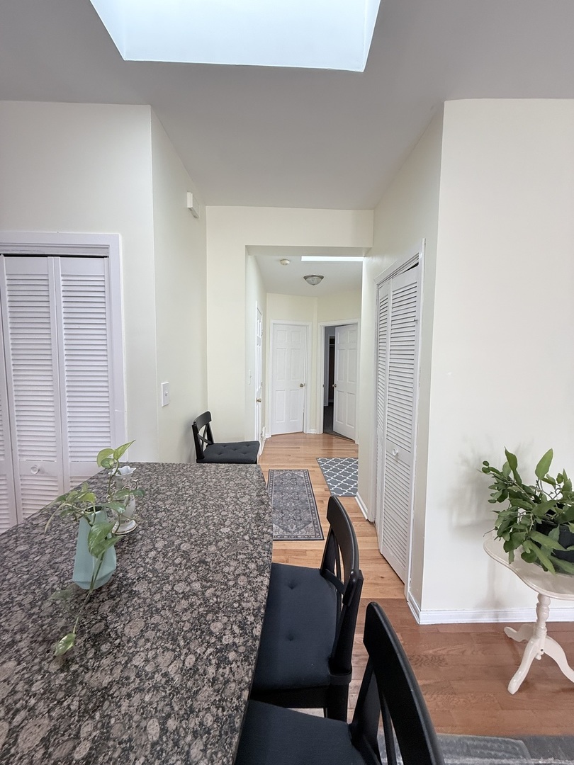 3643 South Hamilton Avenue, Unit 3 Chicago, IL 60609 - Photo 11 of 29 a living room with furniture and a potted plant