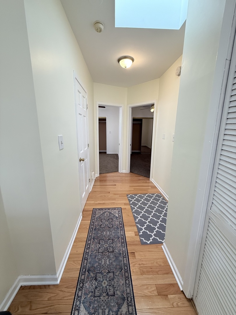 3643 South Hamilton Avenue, Unit 3 Chicago, IL 60609 - Photo 12 of 29 a bedroom with wooden floor and closet
