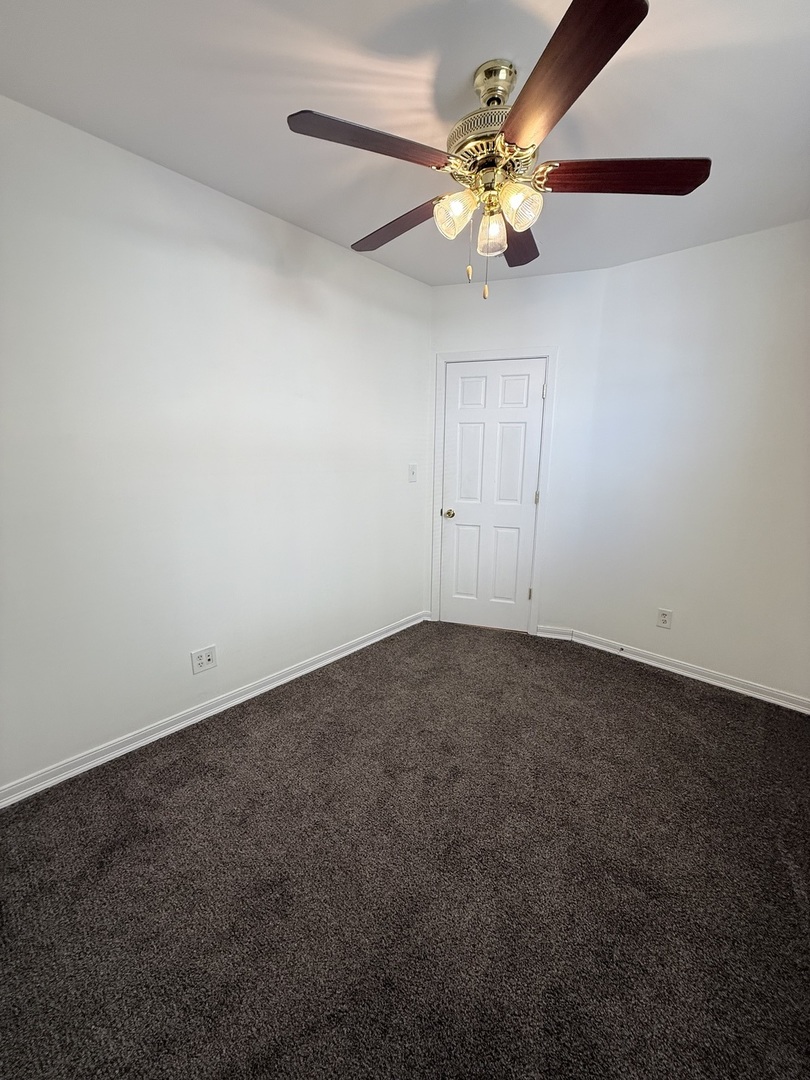 3643 South Hamilton Avenue, Unit 3 Chicago, IL 60609 - Photo 18 of 29 a view of an empty room with chandelier fan