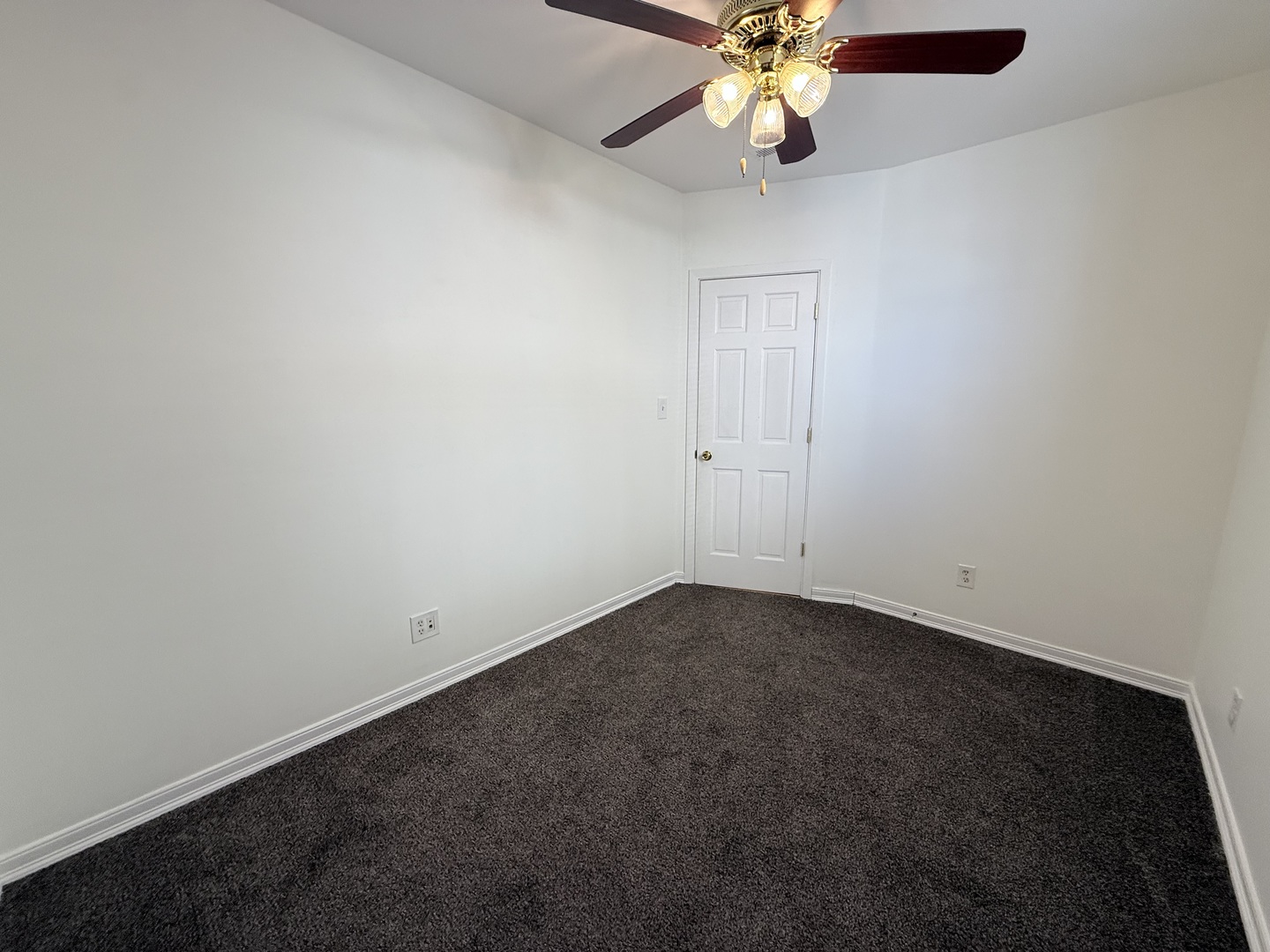 3643 South Hamilton Avenue, Unit 3 Chicago, IL 60609 - Photo 19 of 29 an empty room with a chandelier fan and a ceiling fan
