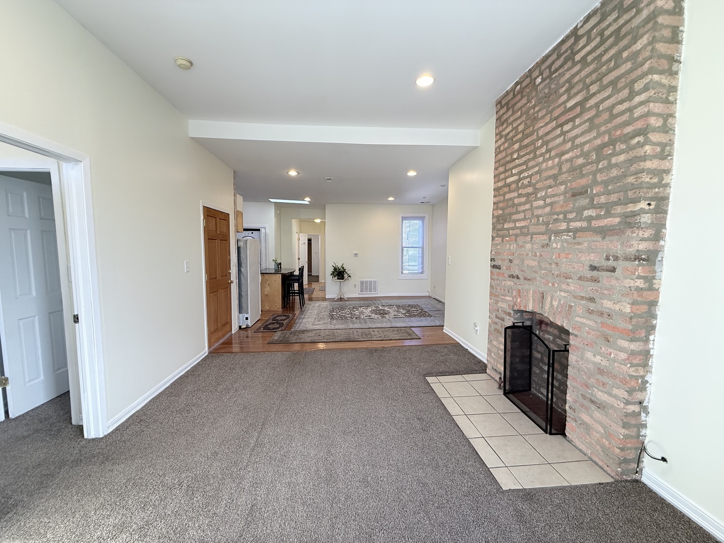 3643 South Hamilton Avenue, Unit 3 Chicago, IL 60609 - Photo 4 of 29 a view of a livingroom with a fireplace dryer and washer