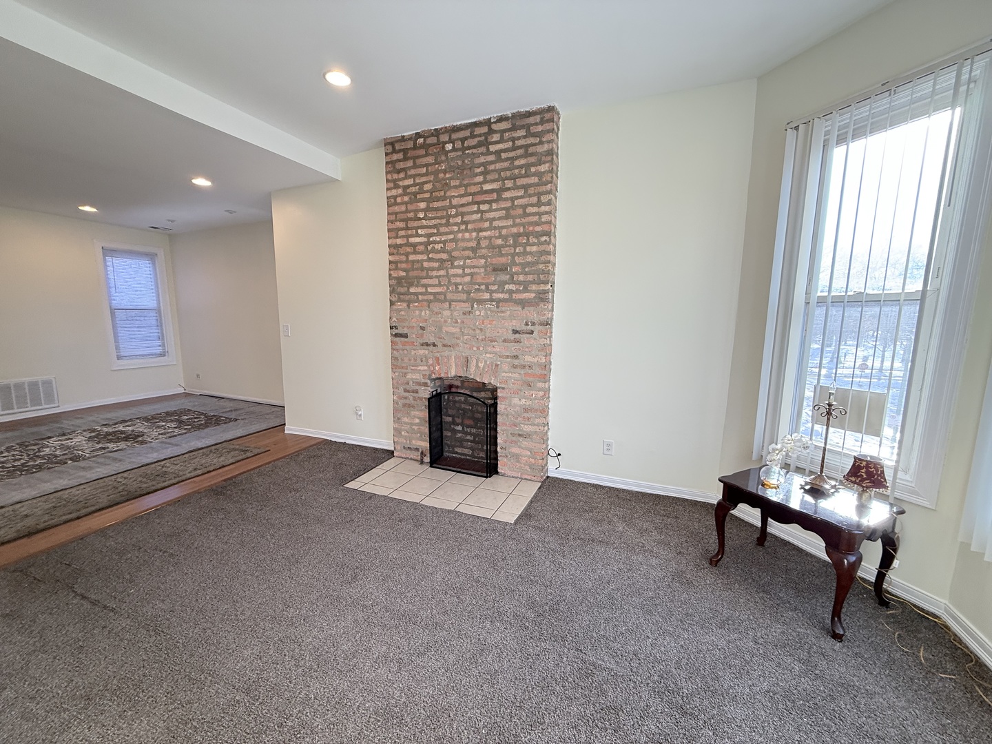 3643 South Hamilton Avenue, Unit 3 Chicago, IL 60609 - Photo 5 of 29 a living room with furniture and a fireplace