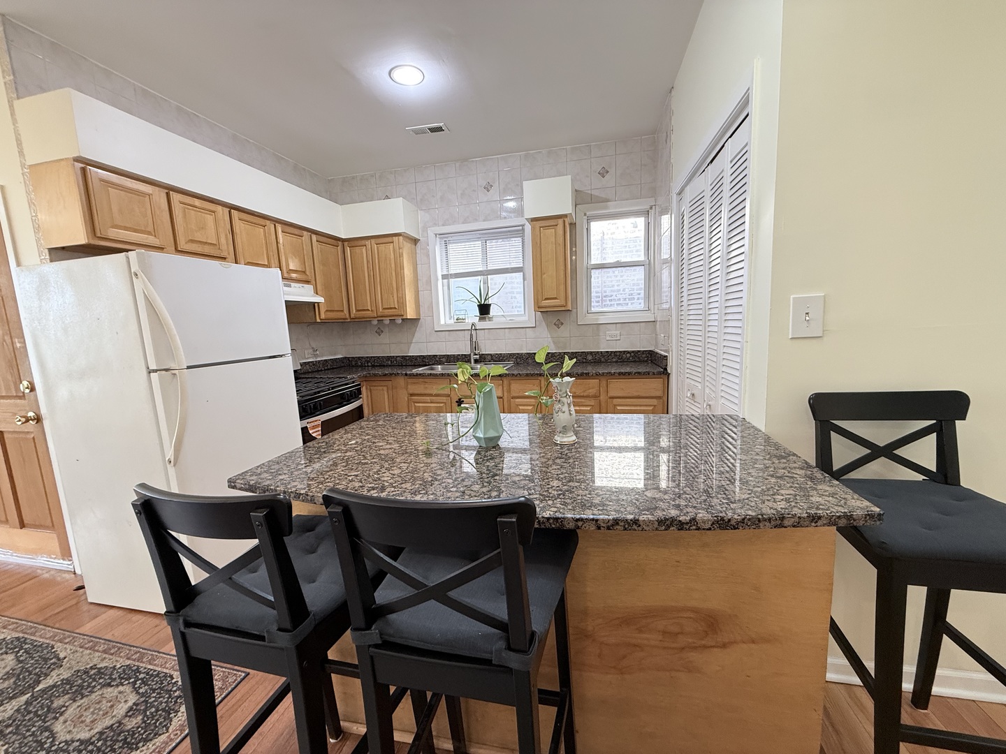 3643 South Hamilton Avenue, Unit 3 Chicago, IL 60609 - Photo 8 of 29 a dining table with chairs and wood floor