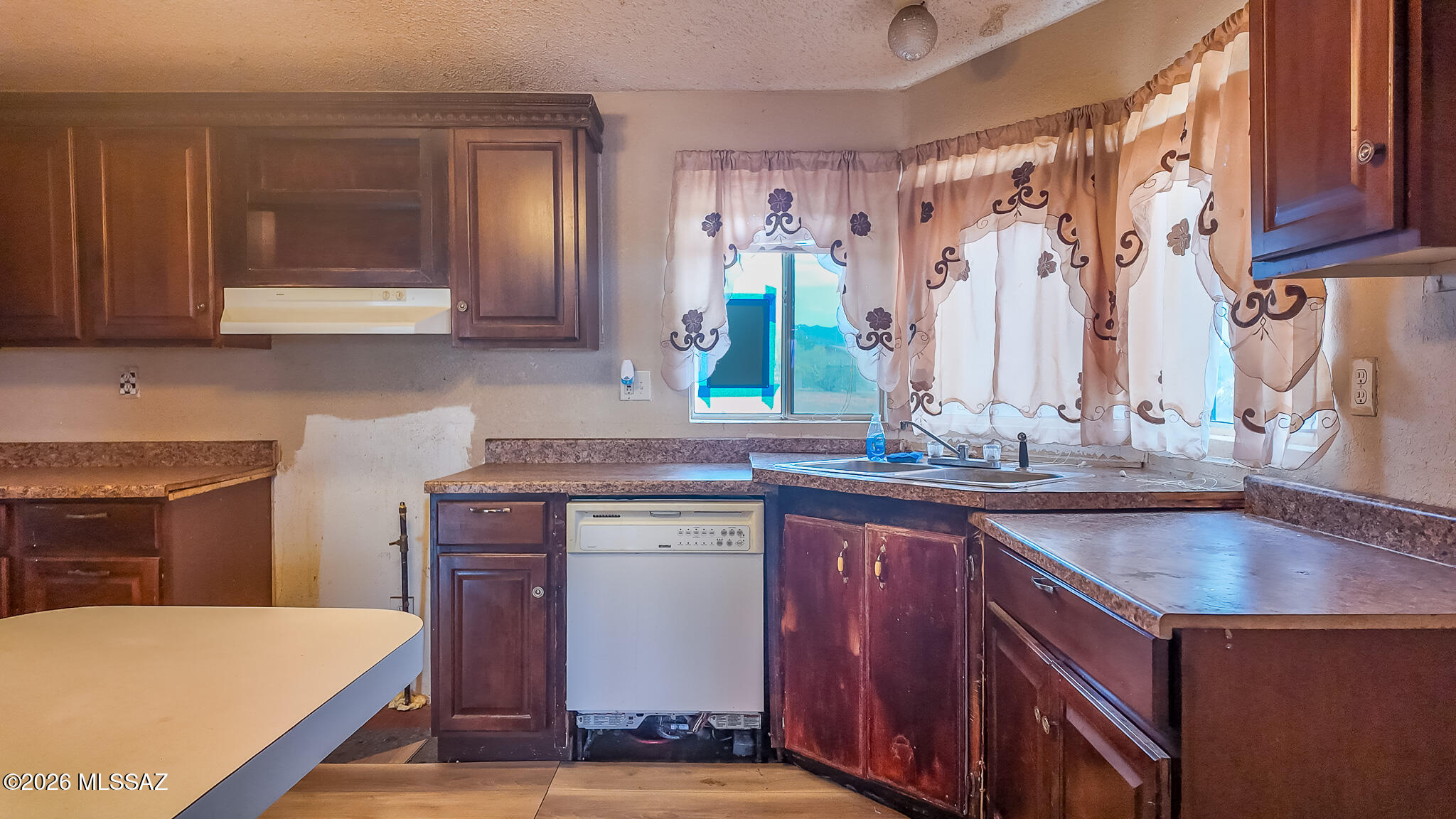 27651 South Canoa Road Amado, AZ 85645 - Photo 2 of 20 a kitchen with a sink cabinets and wooden floor