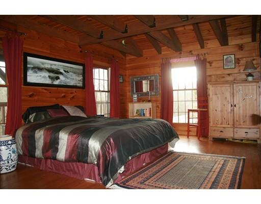270 East Leverett Road Amherst, MA 01002 - Photo 13 of 30 a bedroom with a bed and wooden floor