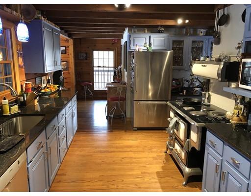 270 East Leverett Road Amherst, MA 01002 - Photo 9 of 30 a kitchen with stainless steel appliances granite countertop a refrigerator a stove top oven and a sink