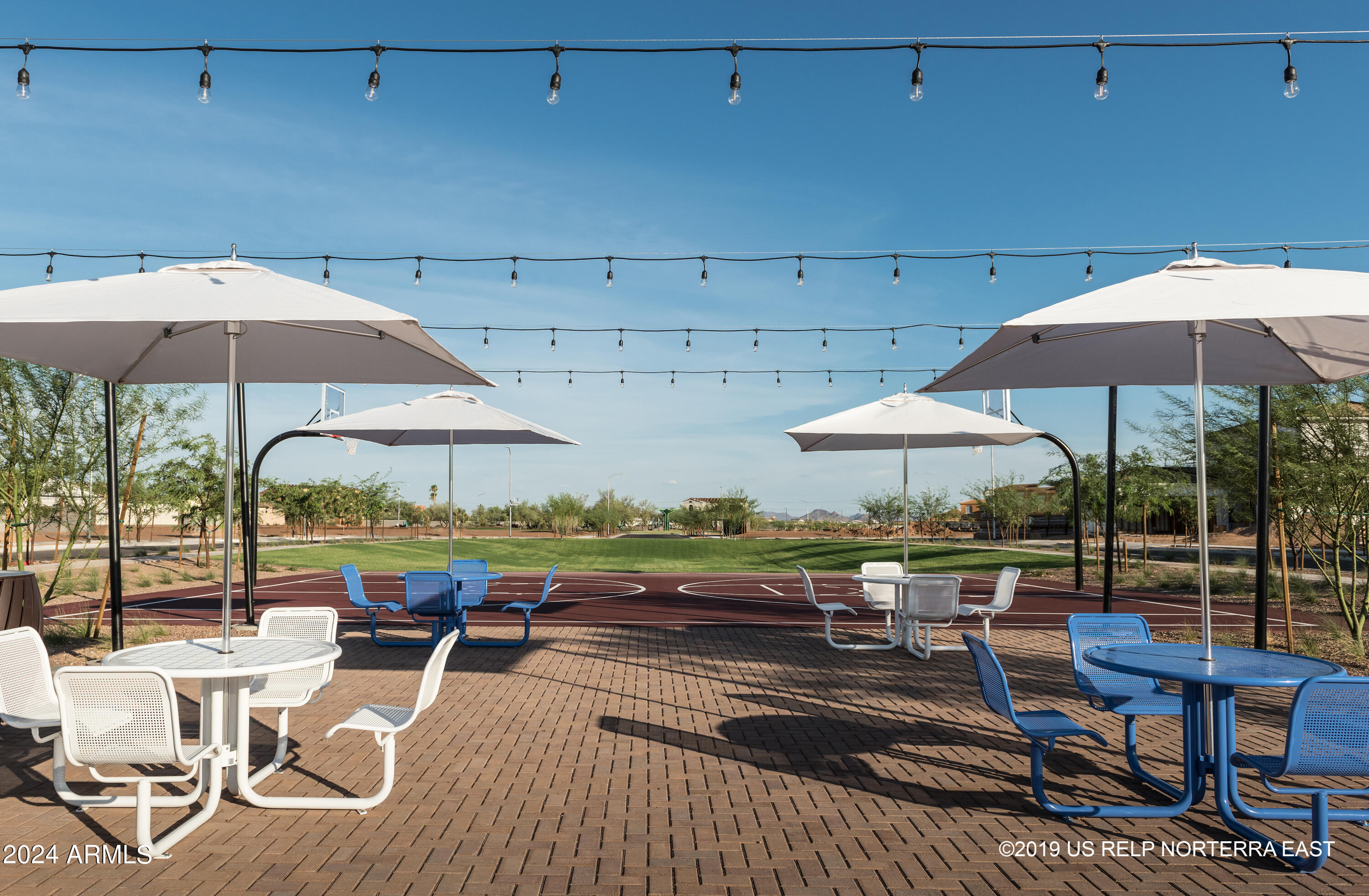 2460 West Rowel Road Phoenix, AZ 85085 - Photo 23 of 25 a view of patio with chairs and table under an umbrella