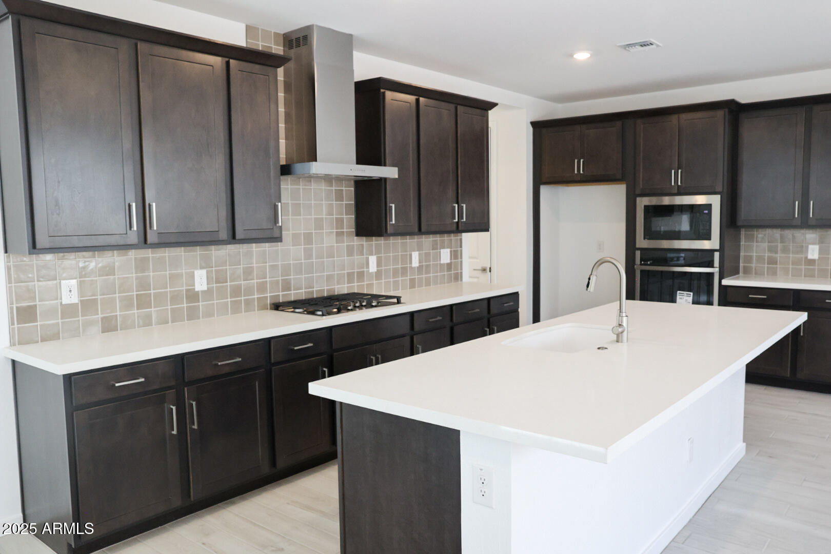 2460 West Rowel Road Phoenix, AZ 85085 - Photo 3 of 25 a kitchen with stainless steel appliances a refrigerator sink and microwave