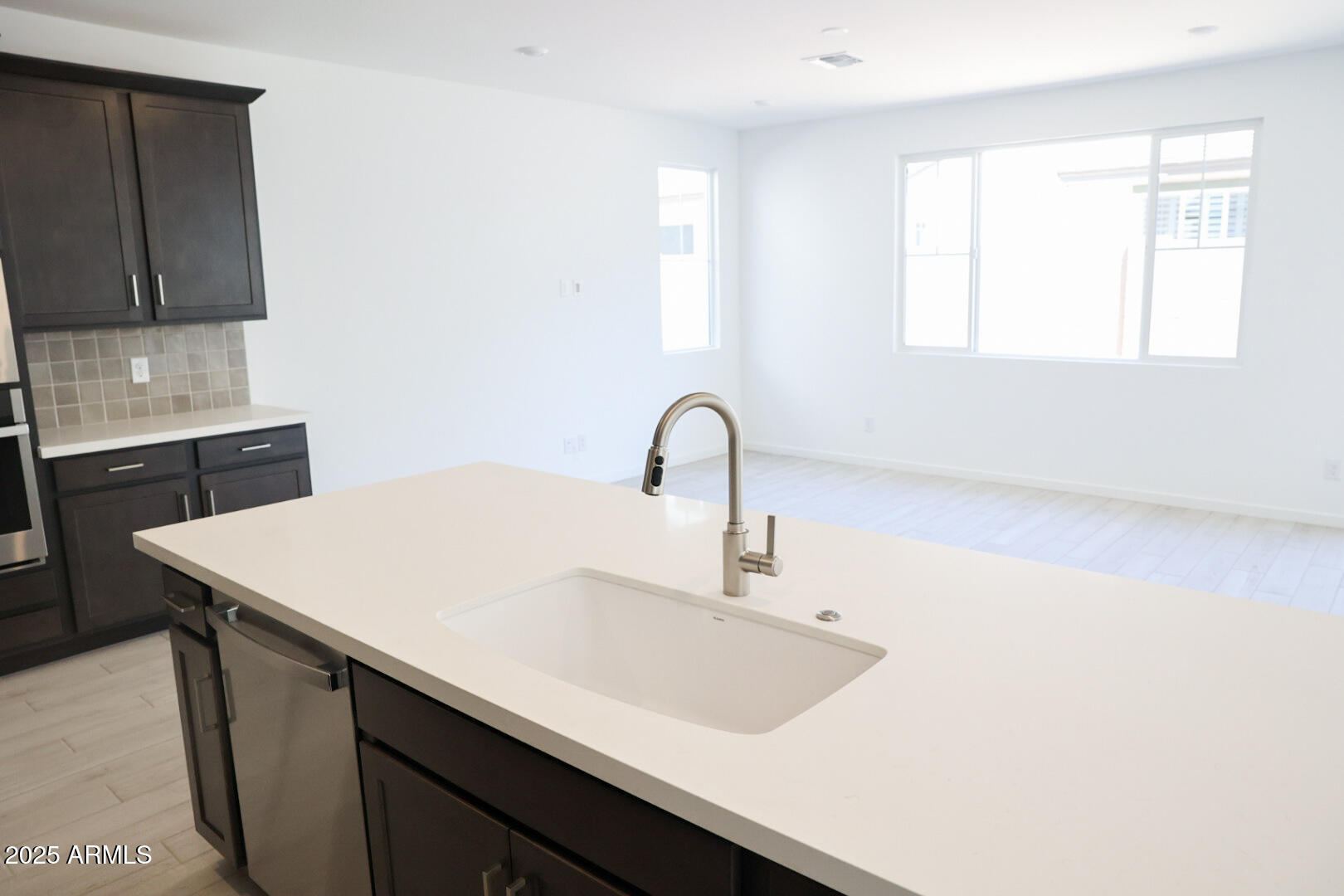 2460 West Rowel Road Phoenix, AZ 85085 - Photo 7 of 25 a kitchen with a sink cabinets and a window