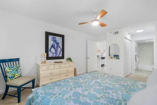 a bedroom with a bed and a table in it