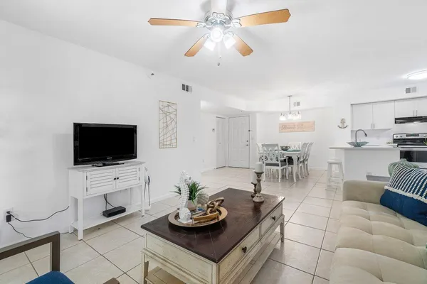 a kitchen with stainless steel appliances a refrigerator sink and microwave