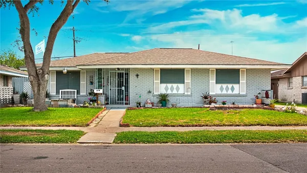 a view of a house with backyard sitting area and garden