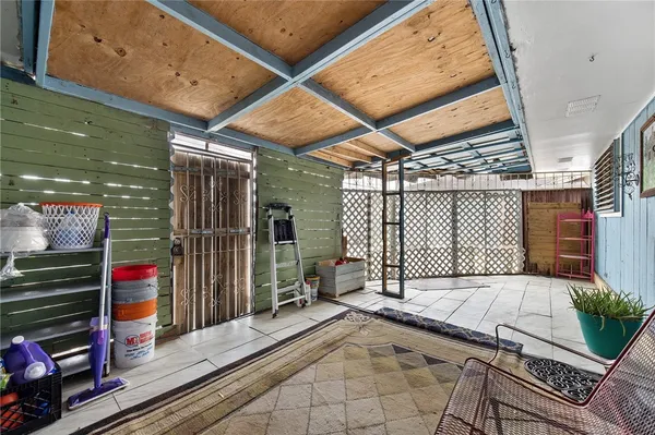 a view of a balcony with furniture