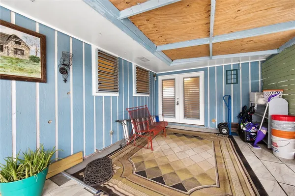 a view of empty room with wooden ceiling