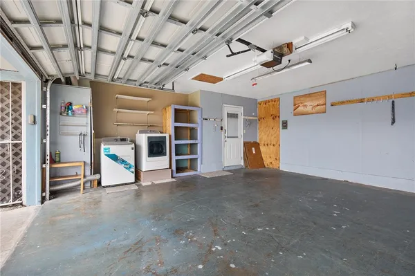 a front view of a house with a garden and yard